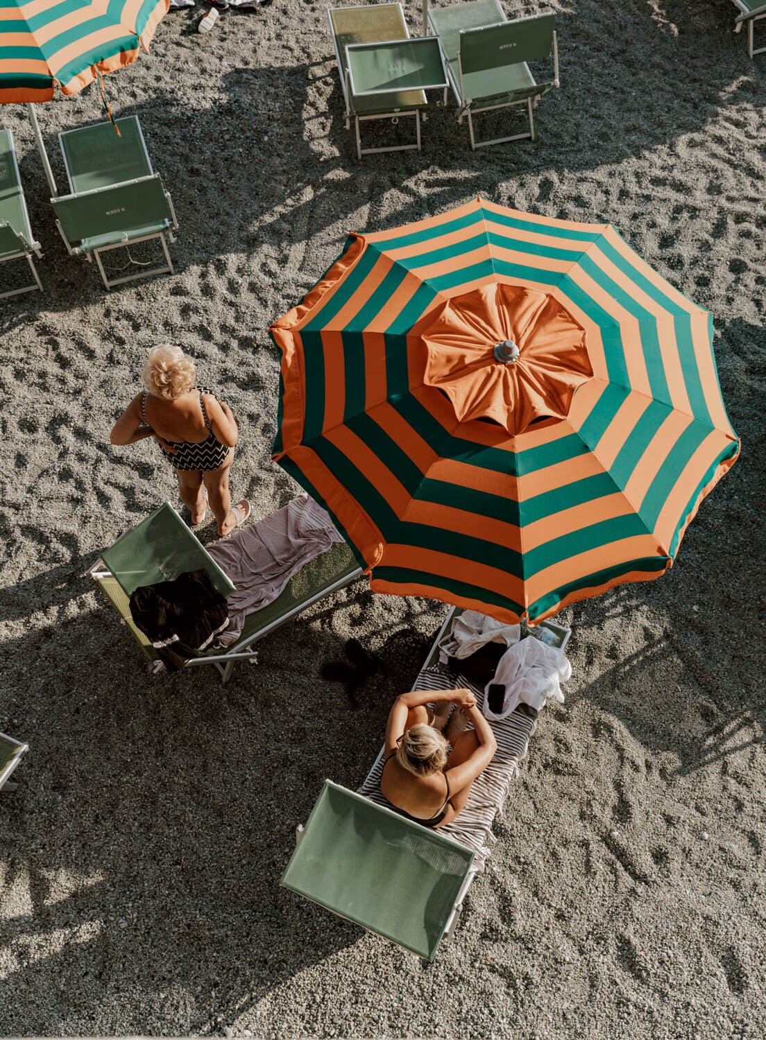 Orang and Green parasols on Monterosso beach