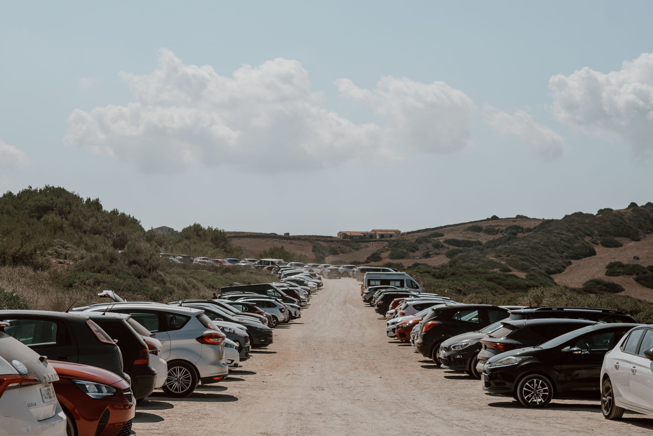 dusty-car-park-menorca-beach